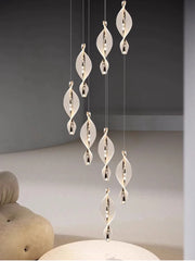 Modern spiral gold LED pendant light with plated iron, dimmable touch control in elegant bedroom
