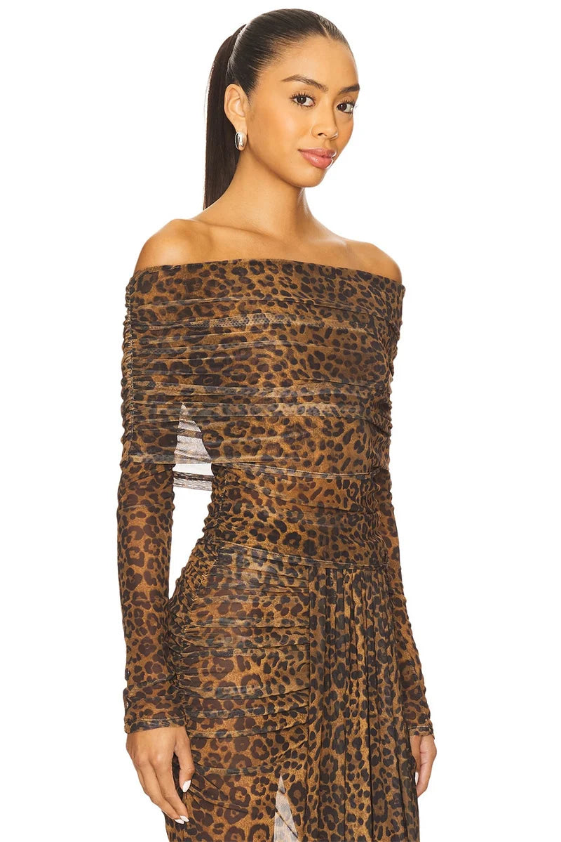 Woman wearing a leopard print off-shoulder dress 