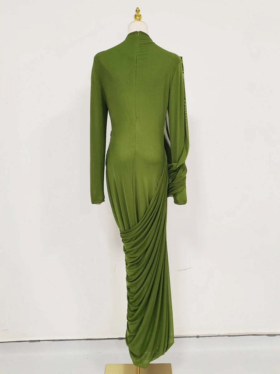 Green dress on a mannequin against a white background