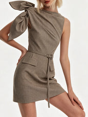 Close-up of asymmetric bow shoulder mini dress