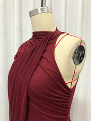 Maroon dress on a mannequin against a white background