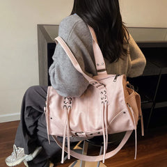 Pink faux leather shoulder bag with lacing details