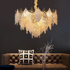 Modern blade chandelier with crystal accents and LED lighting, illuminating a stylish dining room. Golden Atelier 1