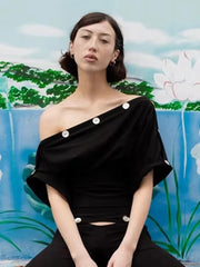 One shoulder black top with decorative buttons