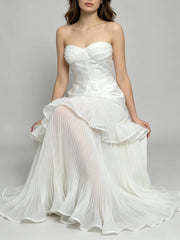 Strapless pleated ruffle gown sitting