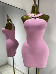 Side view of pink halter neck mini dress with ribbed texture