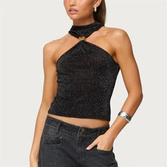 Black sparkly halter top worn by a model on a plain background
