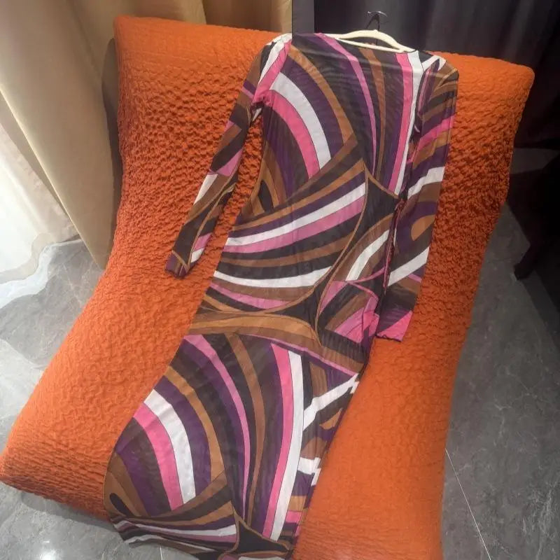 Colorful patterned garment on an orange chair