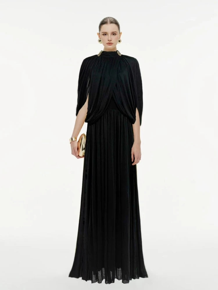 Woman wearing a black evening gown on a white background