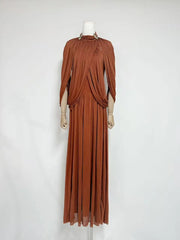 Brown evening gown on a mannequin against a white background