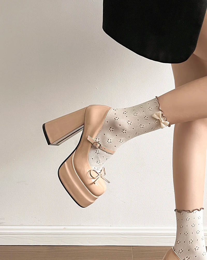 Beige platform shoes with a white background