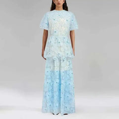 Light blue floral dress worn by a model on a plain background