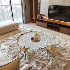 Round mirrored coffee table in a modern living room setting