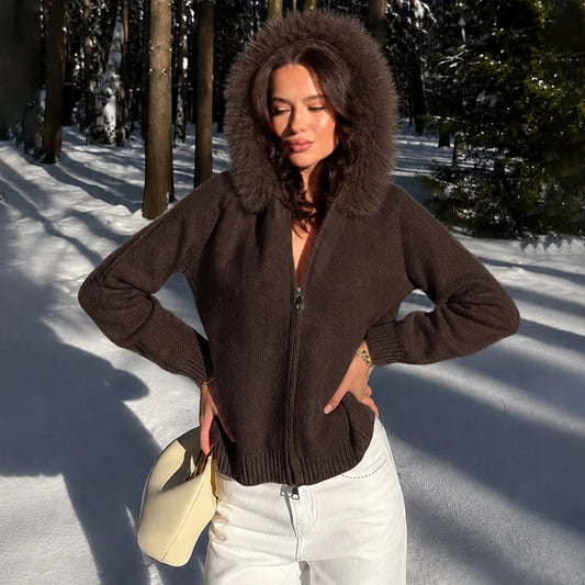 Hooded faux fur trim knit jacket, outdoors in snow
