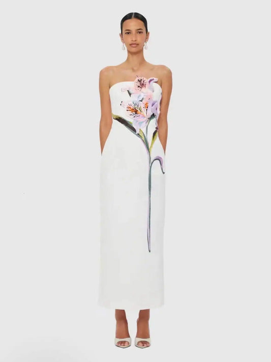 Strapless column maxi dress with floral appliqué in white.