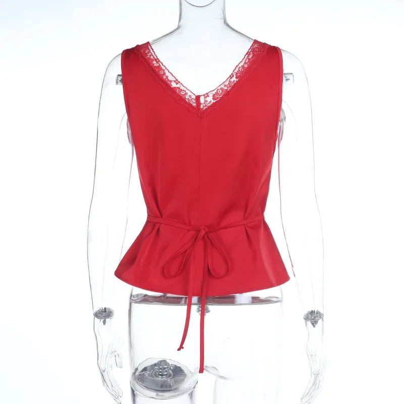 Red peplum top on a mannequin with a white background