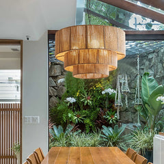 A cozy dining room illuminated by a natural rattan and hemp rope pendant lamp, creating an intimate atmosphere. 3