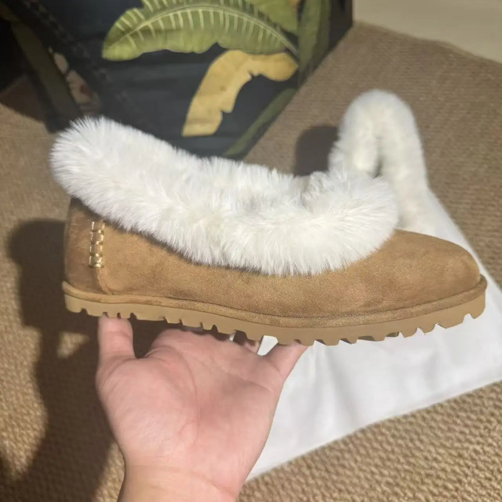 Side profile of a fur trimmed suede ballet flat