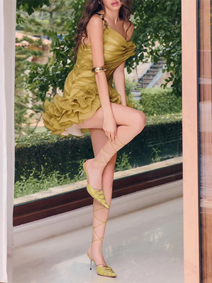 Detail of the ruffled hem on an asymmetrical mini dress.