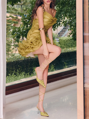 Detail of the ruffled hem on an asymmetrical mini dress.