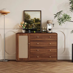 Minimalist console cabinet holding plants, artwork, and a coffee machine
