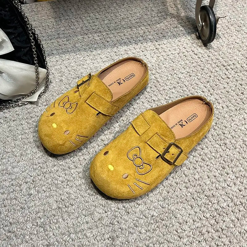 Yellow suede Hello Kitty buckle mules