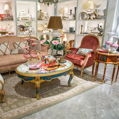 Decorative interior setting with ornate furniture and decor items.