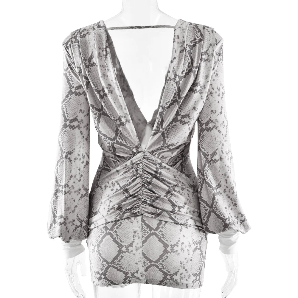 Patterned dress on a mannequin against a white background