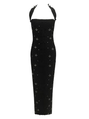 Black dress with white floral patterns on a white background