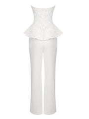 White peplum top and pants set on a white background