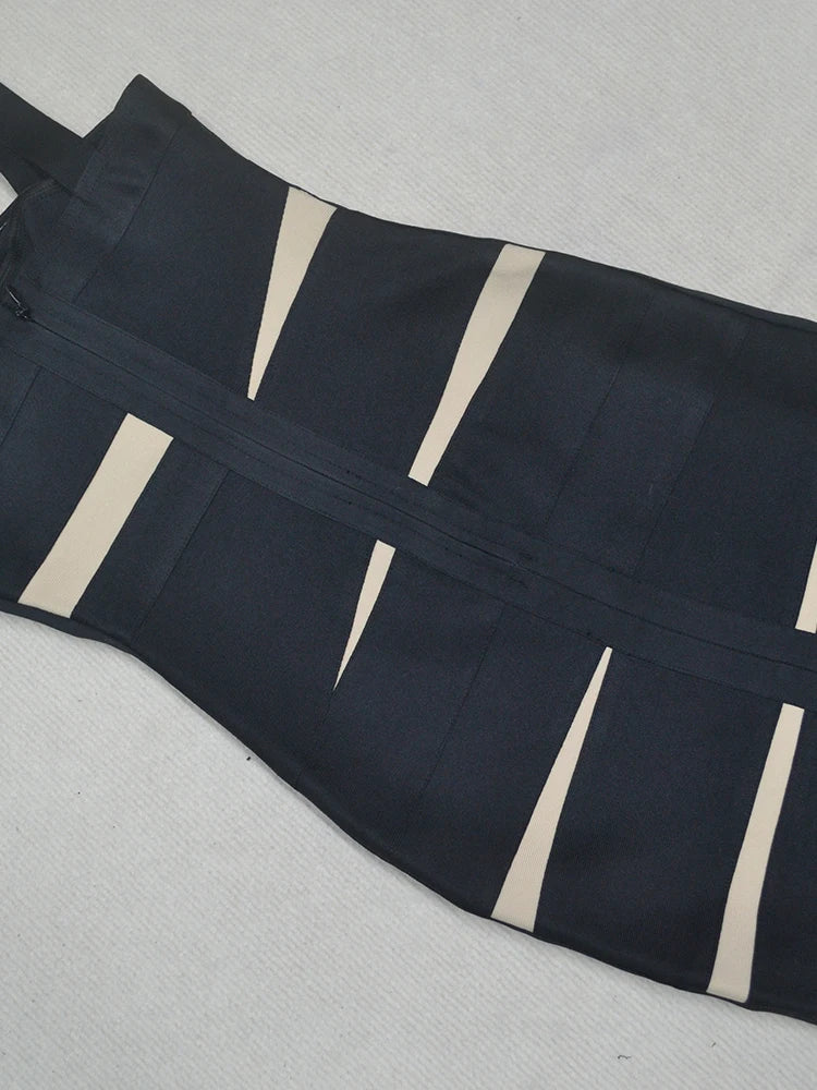Black apron with beige stripes on a light gray background