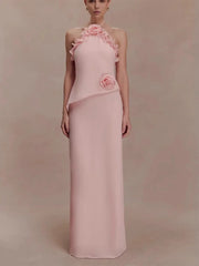 Pink evening gown with floral details on a plain background