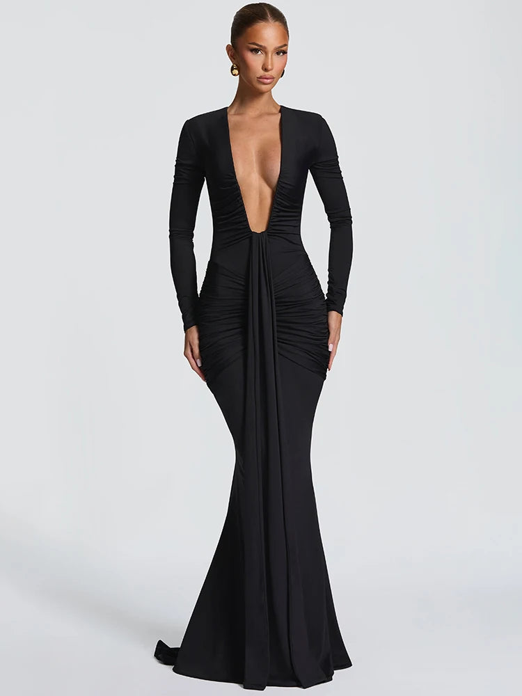 Black evening gown with long sleeves on a white background