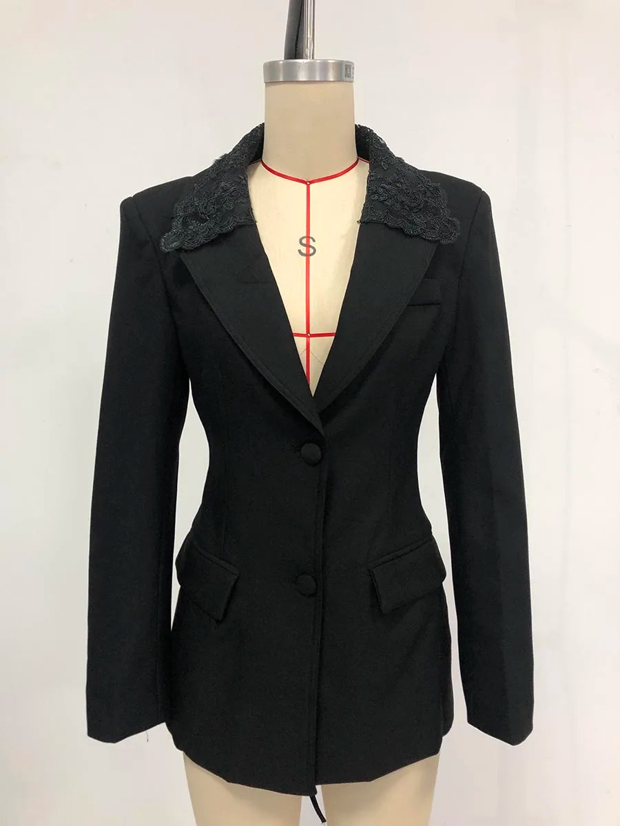 Black blazer with lace details on a mannequin against a white background