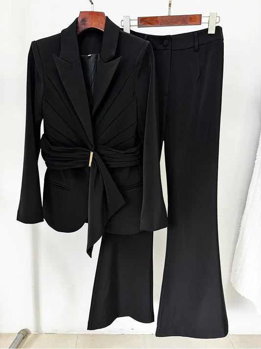Black belted blazer and flared trousers suit hanging
