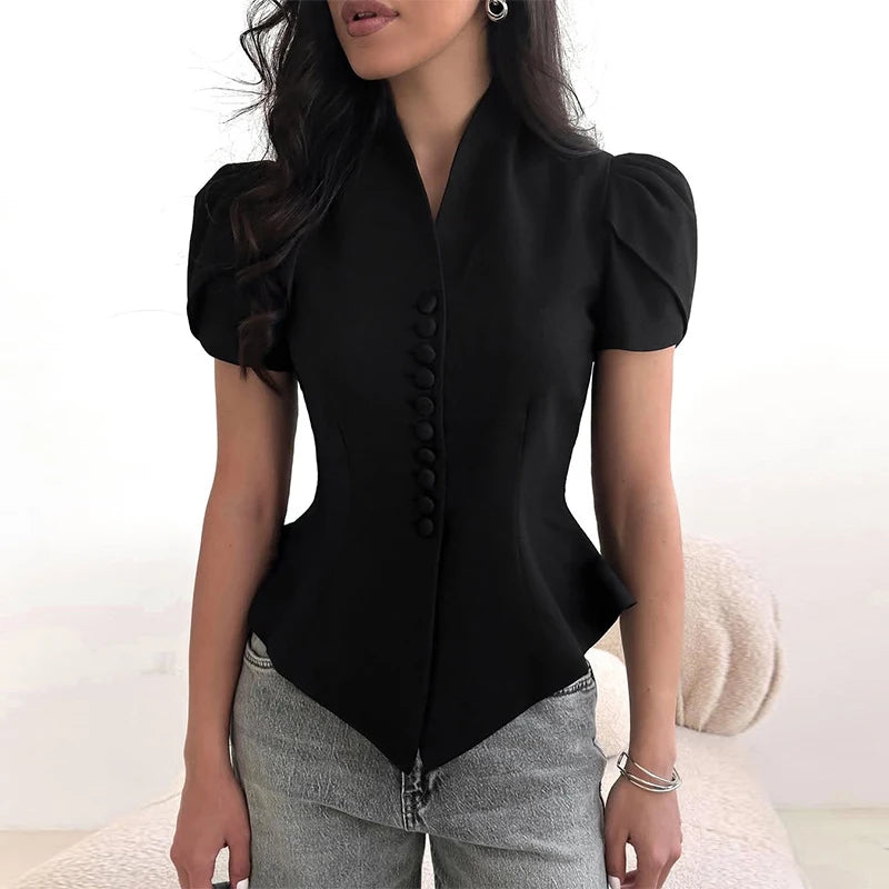 Black short-sleeve blouse with button details worn by a person on a white background