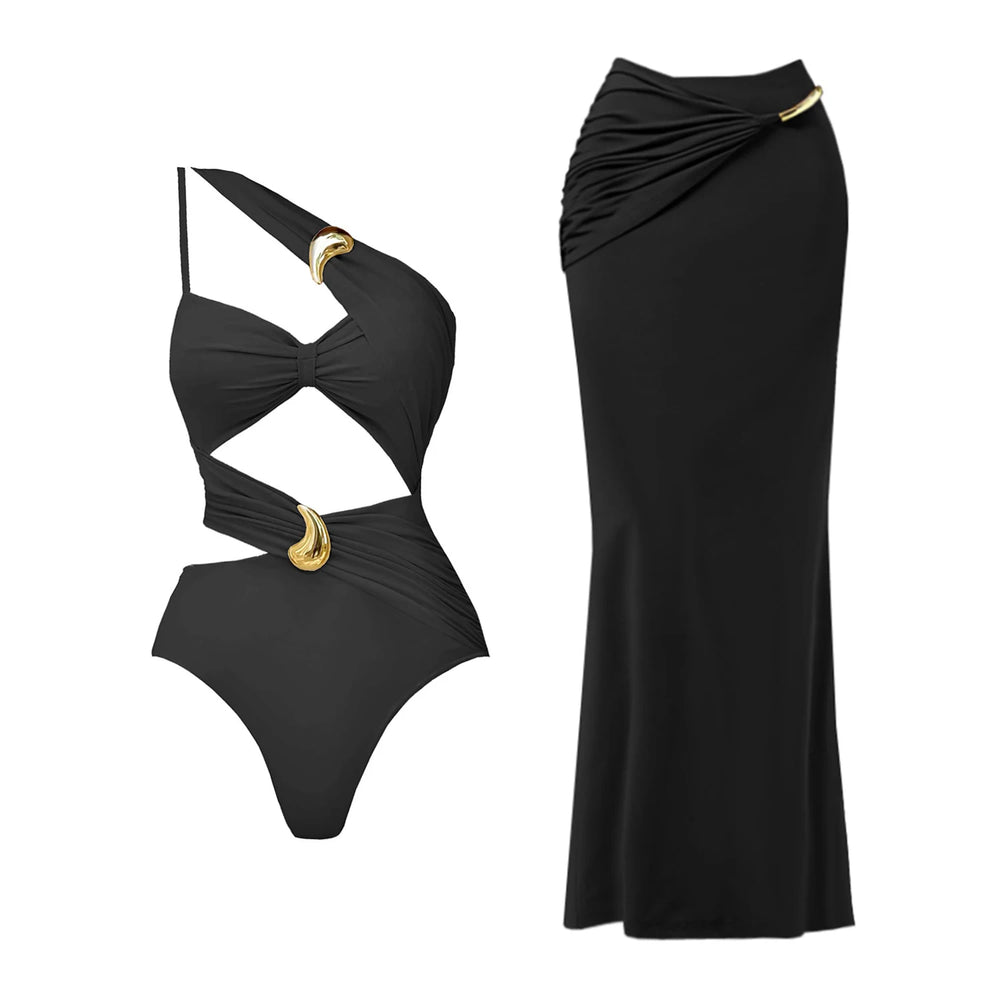 Black one shoulder swimsuit with cut-outs and a maxi skirt