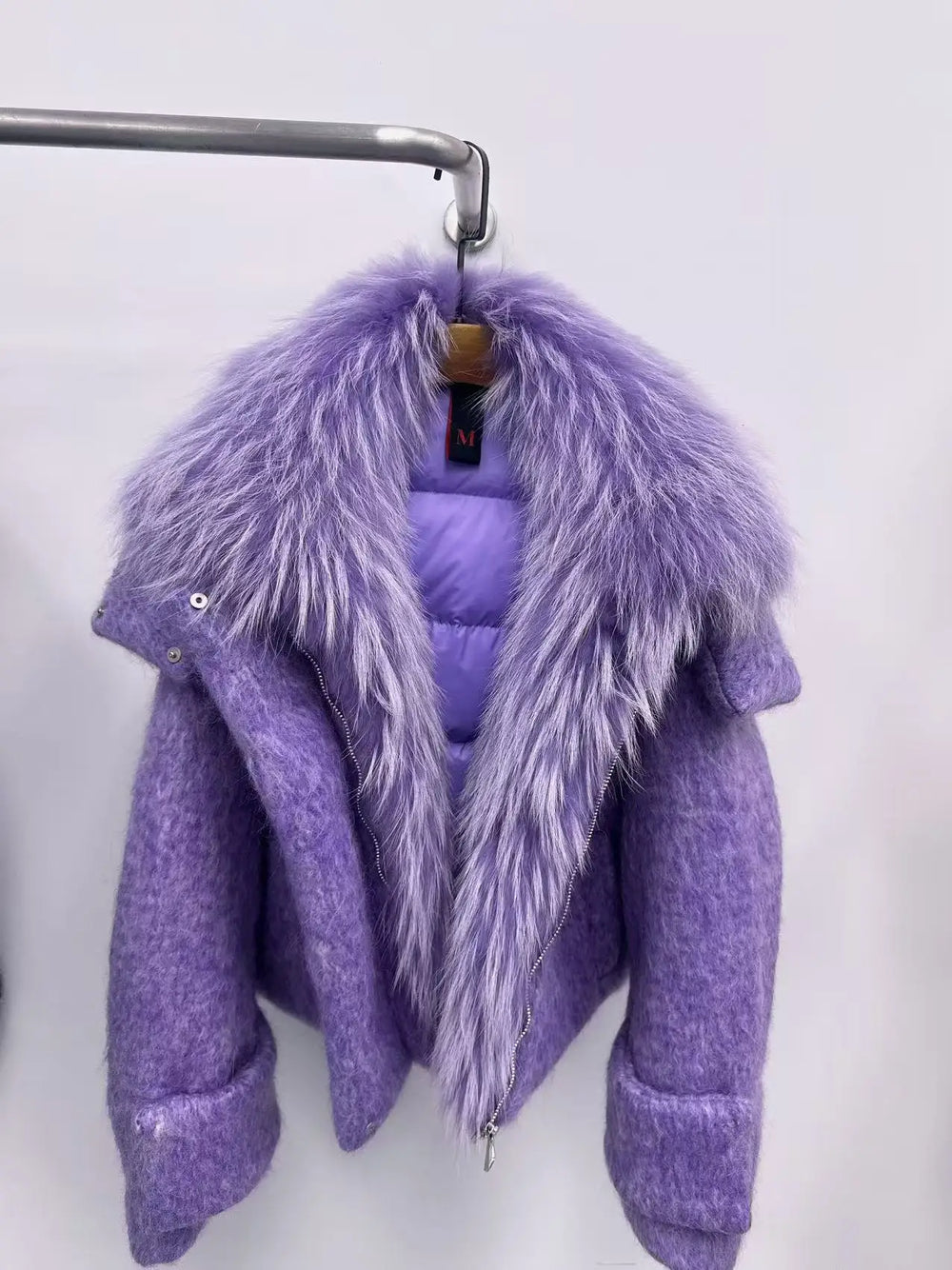 Purple jacket with fur collar on a white background