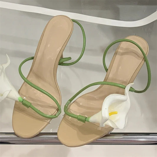 Transparent flower stiletto heels in beige with green straps