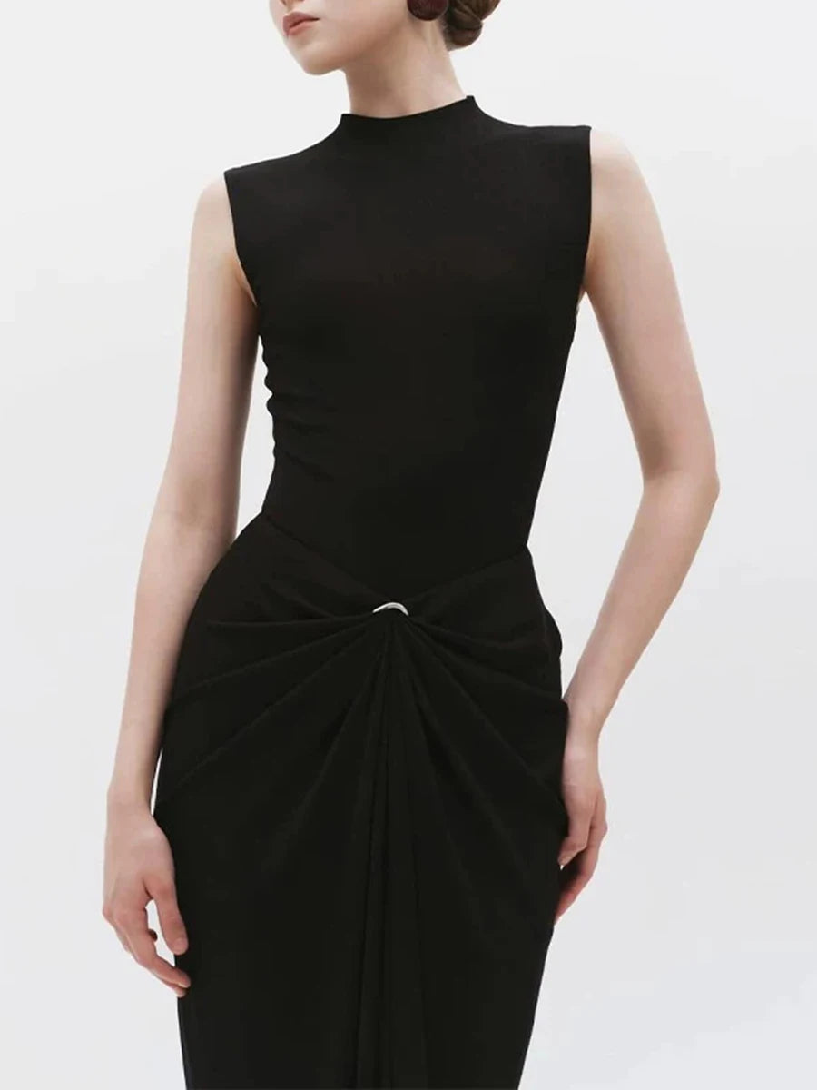 Close-up of metal buckle detail on draped maxi dress