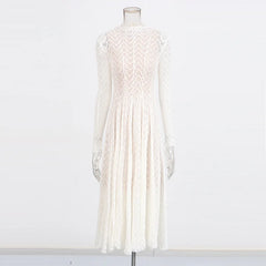 White lace dress on a mannequin against a white background