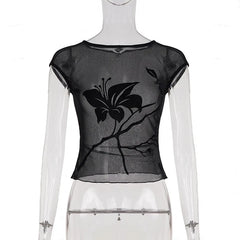 Black sheer top with butterfly design on a mannequin against a white background
