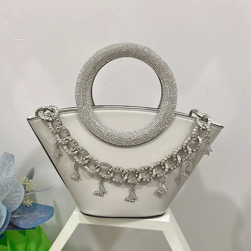 White crystal handle trapezoid tote bag with silver chain detail