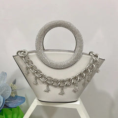 White crystal handle trapezoid tote bag with silver chain detail