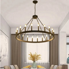 Chandelier hanging in a dining room with curtains and table setting.