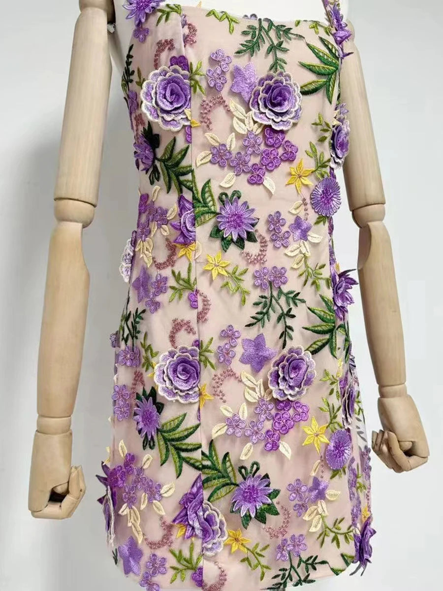Floral dress with purple flowers on a mannequin against a white background