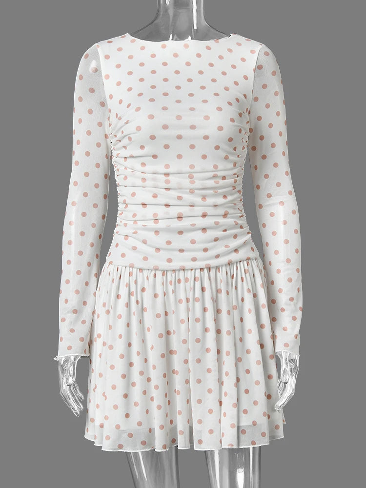 Polka dot ruched mini dress on mannequin
