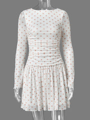 Polka dot ruched mini dress on mannequin