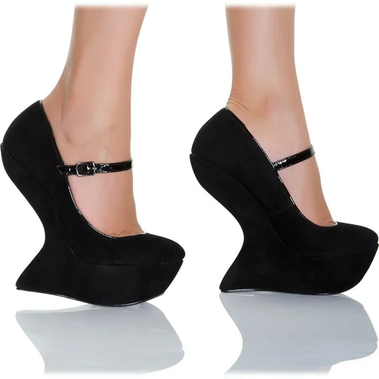 Black sculpted wedge heel pumps with peep toe and ankle strap