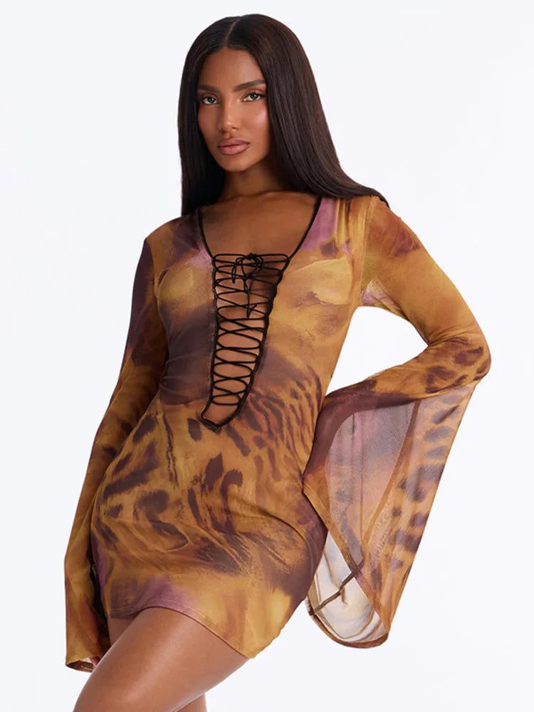 Close-up of the leopard print and lace-up detail on a mini dress